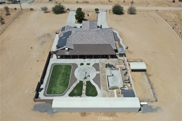 a view of a terrace with a table and chairs
