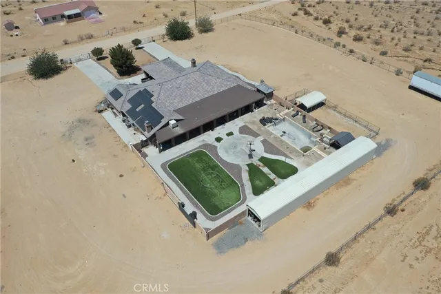 an aerial view of a house with a outdoor space