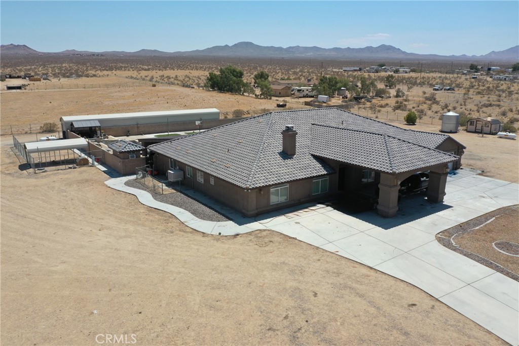24625 Ledbury Road Oro Grande, CA 92368 - Photo 17 of 51 a view of a terrace with a table and chairs