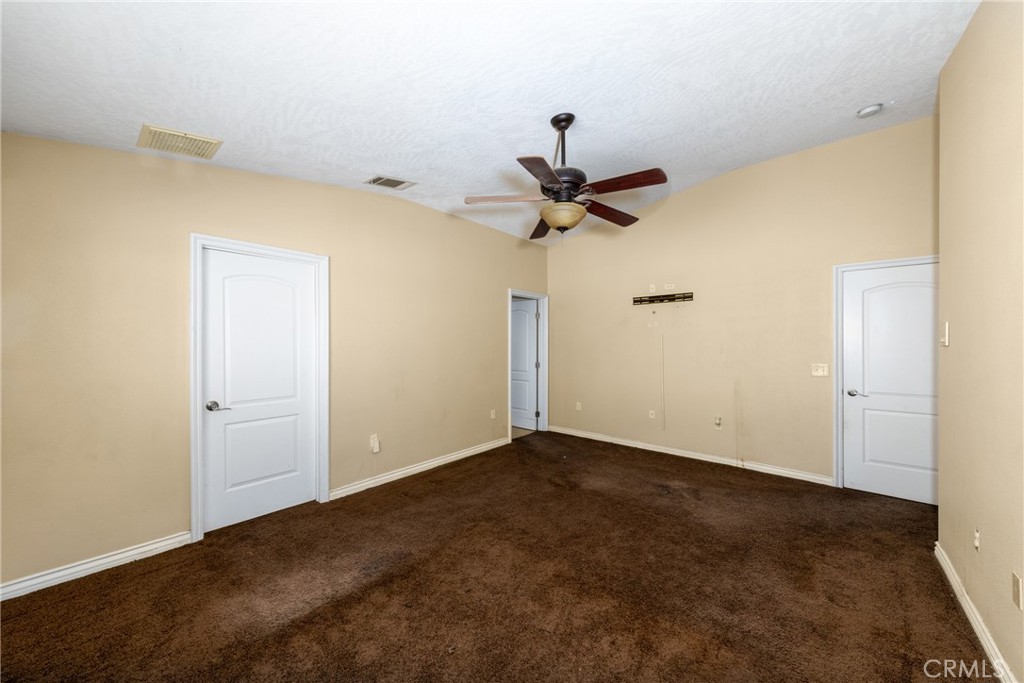 24625 Ledbury Road Oro Grande, CA 92368 - Photo 29 of 51 a view of room with a ceiling fan