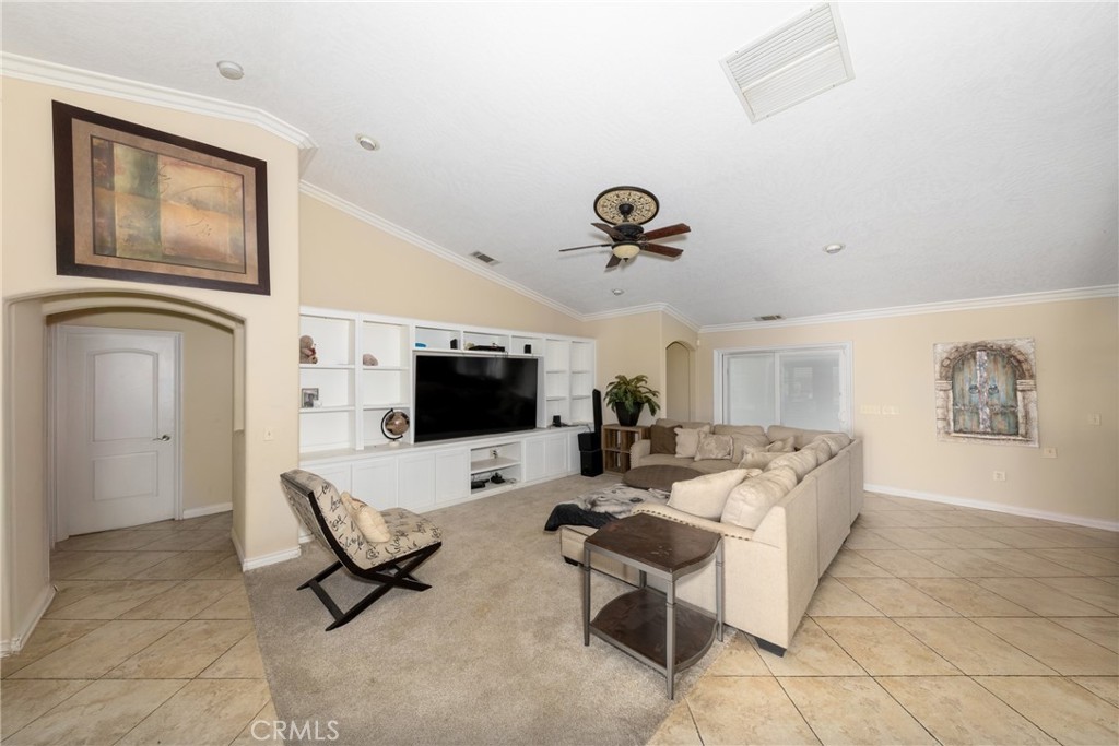 24625 Ledbury Road Oro Grande, CA 92368 - Photo 34 of 51 a living room with furniture and a flat screen tv