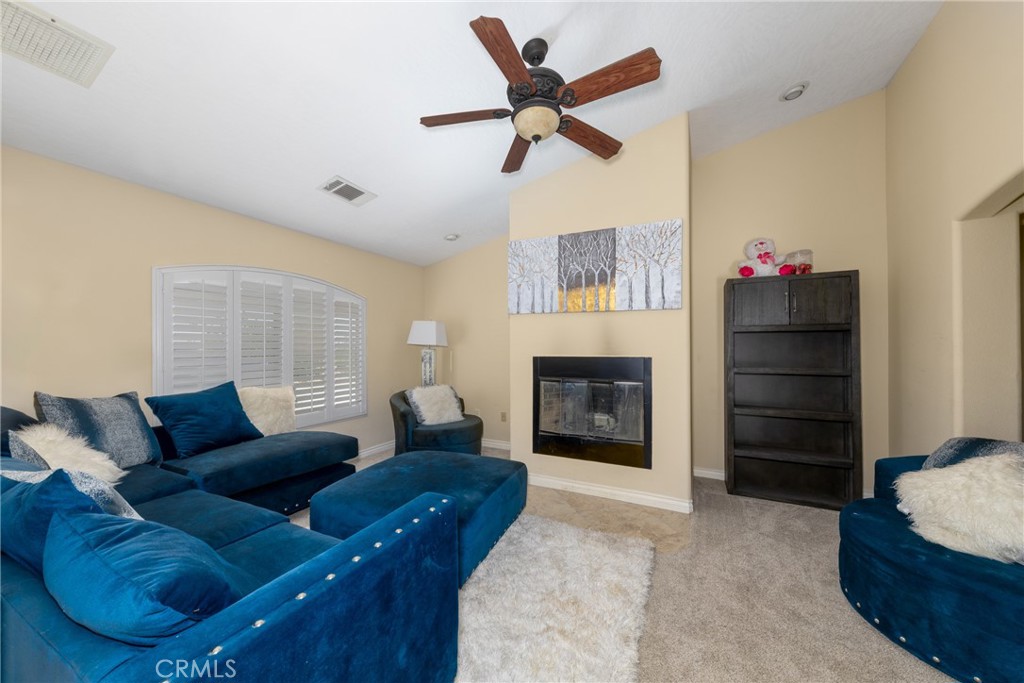 24625 Ledbury Road Oro Grande, CA 92368 - Photo 38 of 51 a living room with furniture and a fireplace