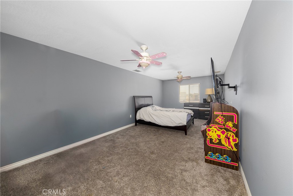 24625 Ledbury Road Oro Grande, CA 92368 - Photo 40 of 51 a bedroom with furniture and a window