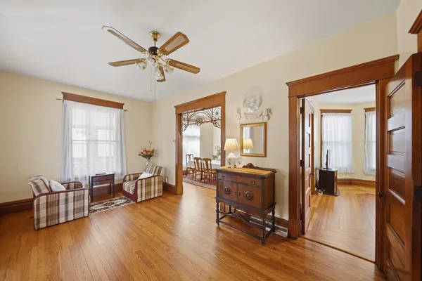 a living room with furniture gym equipment and a large window