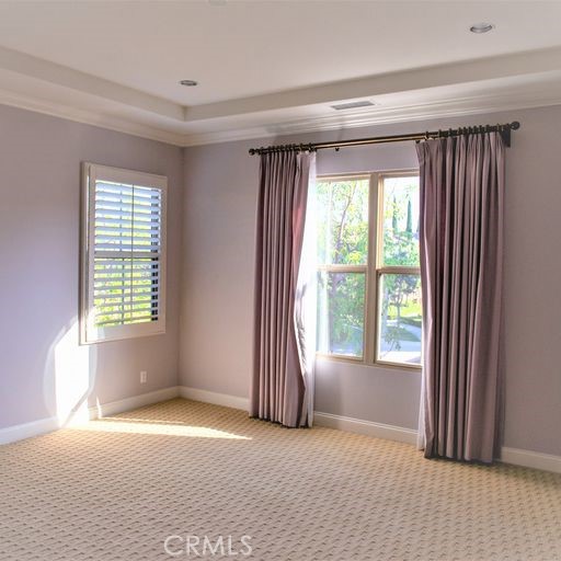 56 Twin Gables Irvine, CA 92620 - Photo 20 of 32 a view of an empty room with a fireplace and a window