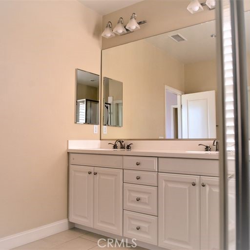 56 Twin Gables Irvine, CA 92620 - Photo 24 of 32 a bathroom with a granite countertop sink mirror and a