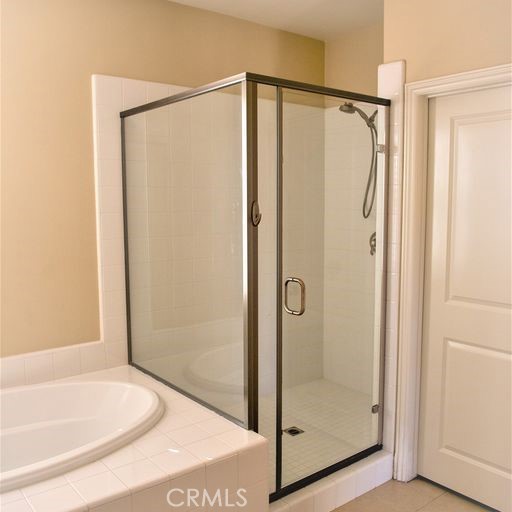 56 Twin Gables Irvine, CA 92620 - Photo 25 of 32 a bathroom with a glass shower door