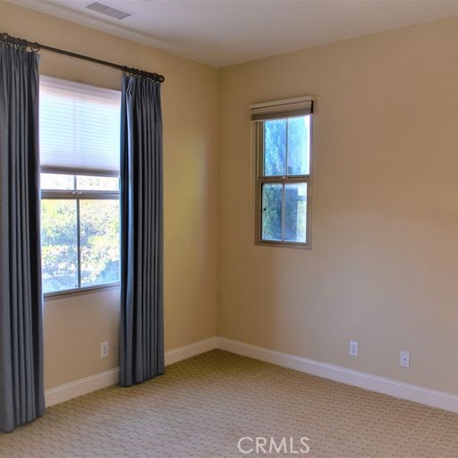 56 Twin Gables Irvine, CA 92620 - Photo 27 of 32 an empty room with windows