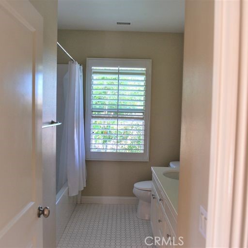 56 Twin Gables Irvine, CA 92620 - Photo 28 of 32 a bathroom with a toilet sink and a bathtub