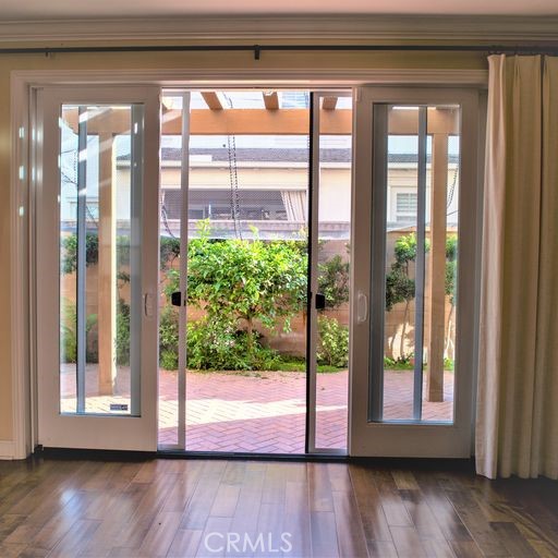 56 Twin Gables Irvine, CA 92620 - Photo 29 of 32 a view of a room that has wooden floor