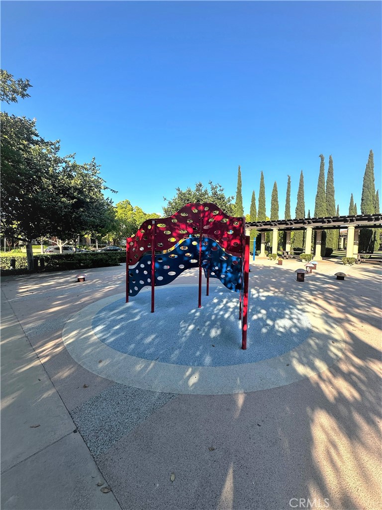 56 Twin Gables Irvine, CA 92620 - Photo 31 of 32 a roof deck with table and chairs and potted plants