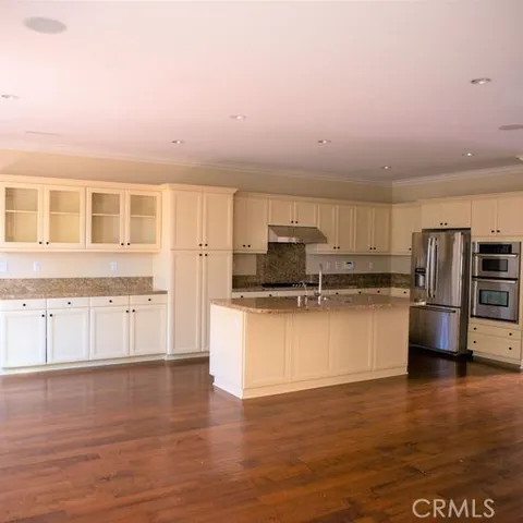 a kitchen with appliances and cabinets