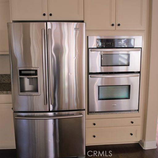 56 Twin Gables Irvine, CA 92620 - Photo 9 of 32 a kitchen with appliances and cabinets