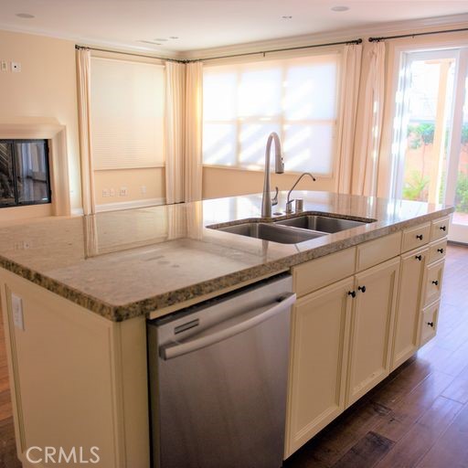 56 Twin Gables Irvine, CA 92620 - Photo 10 of 32 a kitchen with granite countertop a sink and a window