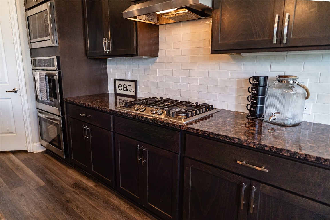 2616 Pine Branch Road Leander, TX 78641 - Photo 11 of 37 a kitchen with stainless steel appliances granite countertop a sink stove and refrigerator