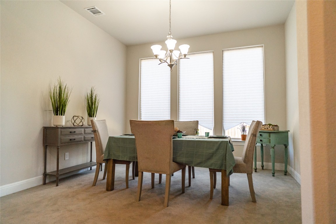 2616 Pine Branch Road Leander, TX 78641 - Photo 12 of 37 a view of a dining room with furniture and window
