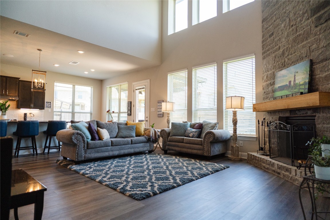 2616 Pine Branch Road Leander, TX 78641 - Photo 13 of 37 a living room with furniture and a fireplace