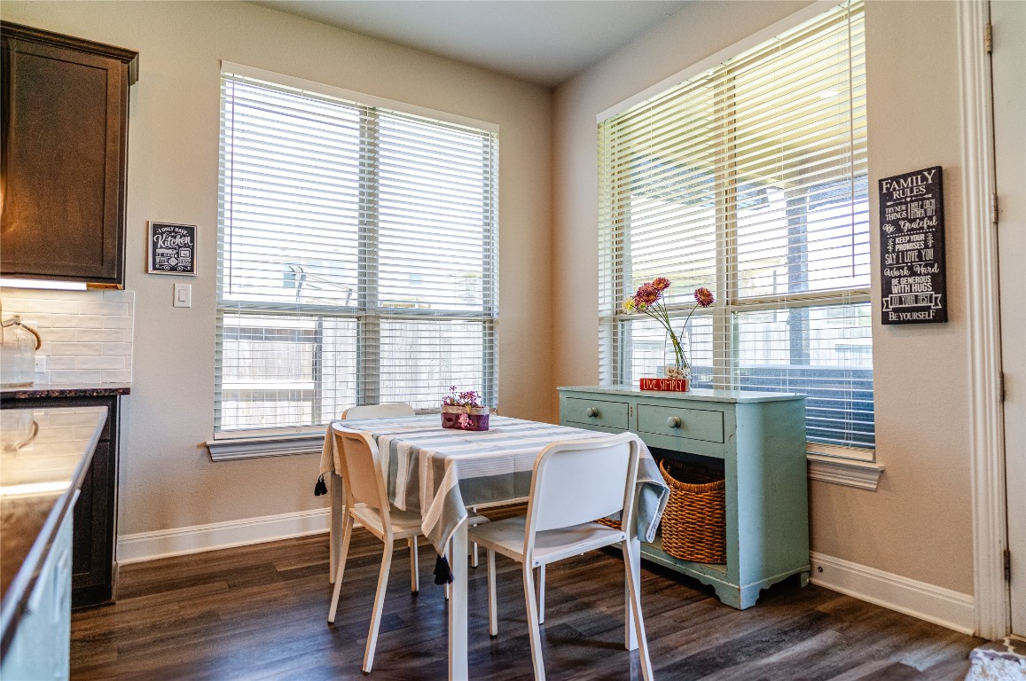 2616 Pine Branch Road Leander, TX 78641 - Photo 14 of 37 a dining room with furniture window wooden floor