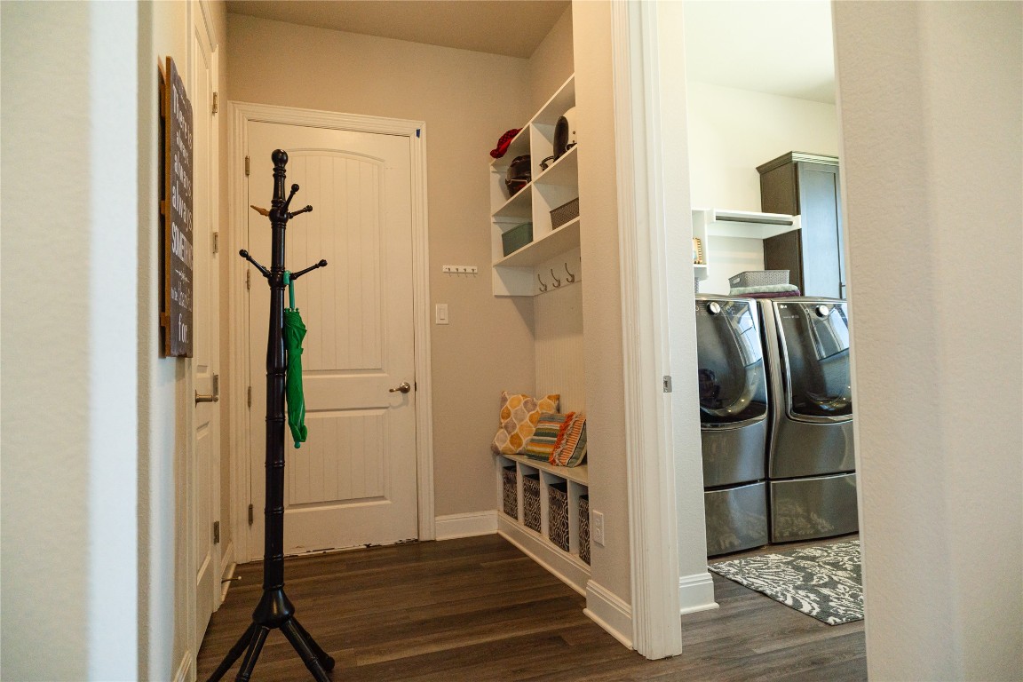 2616 Pine Branch Road Leander, TX 78641 - Photo 17 of 37 a view of a hallway with wooden floor and staircase