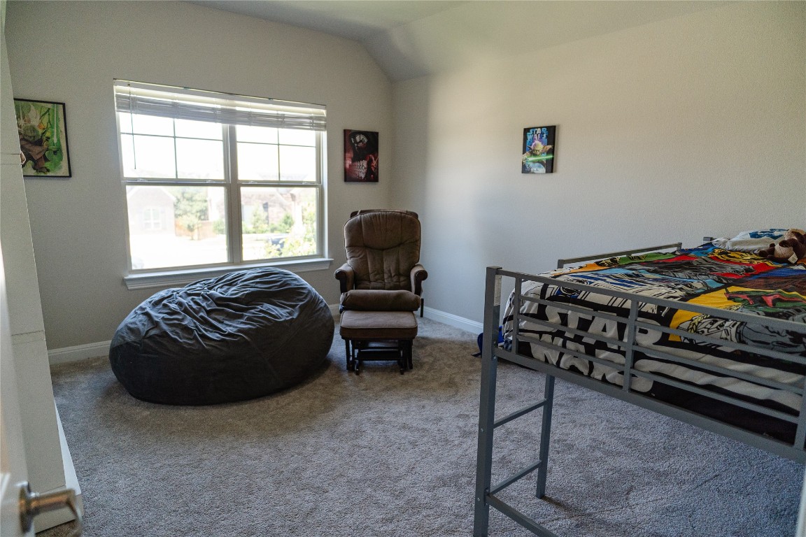 2616 Pine Branch Road Leander, TX 78641 - Photo 28 of 37 a room with a bed and a chair