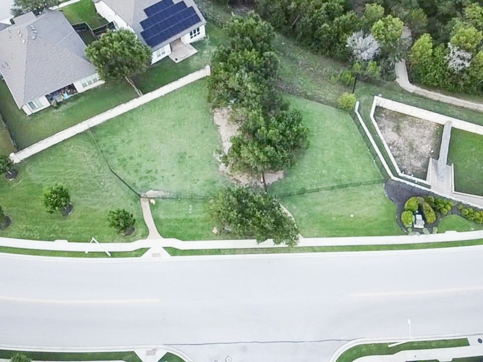 2616 Pine Branch Road Leander, TX 78641 - Photo 37 of 37 an aerial view of a house with a yard and lake view