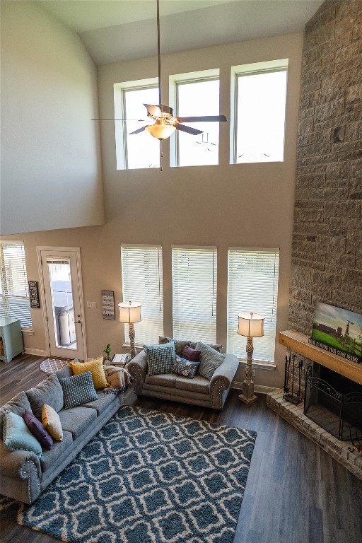 2616 Pine Branch Road Leander, TX 78641 - Photo 9 of 37 a living room with furniture wooden floor and a fireplace