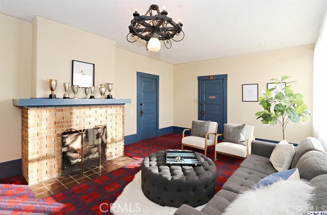 6401 Ruby Street Los Angeles, CA 90042 - Photo 16 of 27 a living room with furniture and a fireplace