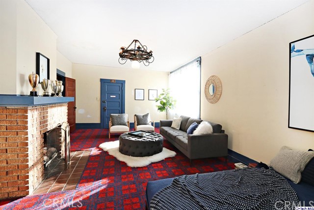 6401 Ruby Street Los Angeles, CA 90042 - Photo 18 of 27 a living room with furniture a fireplace and decor