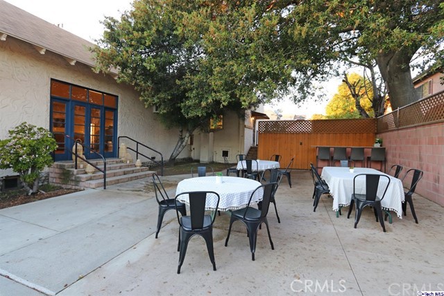 6401 Ruby Street Los Angeles, CA 90042 - Photo 2 of 27 a view of a patio with table and chairs and potted plants