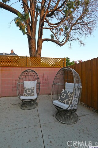 6401 Ruby Street Los Angeles, CA 90042 - Photo 25 of 27 a view of a bird sitting on the floor in front of a house