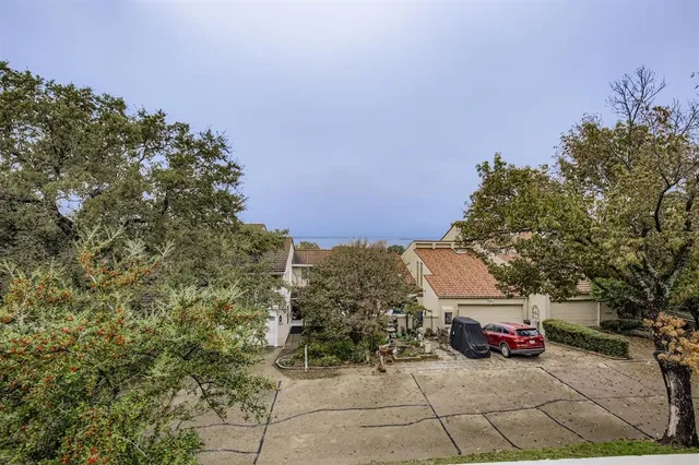 a view of a car parked in front of a building