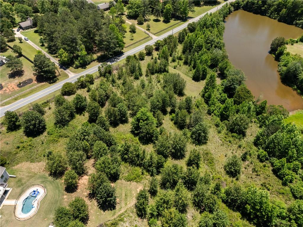 6707 Bishop Road Fairburn, GA 30213 - Photo 7 of 10 an aerial view of a house with a yard
