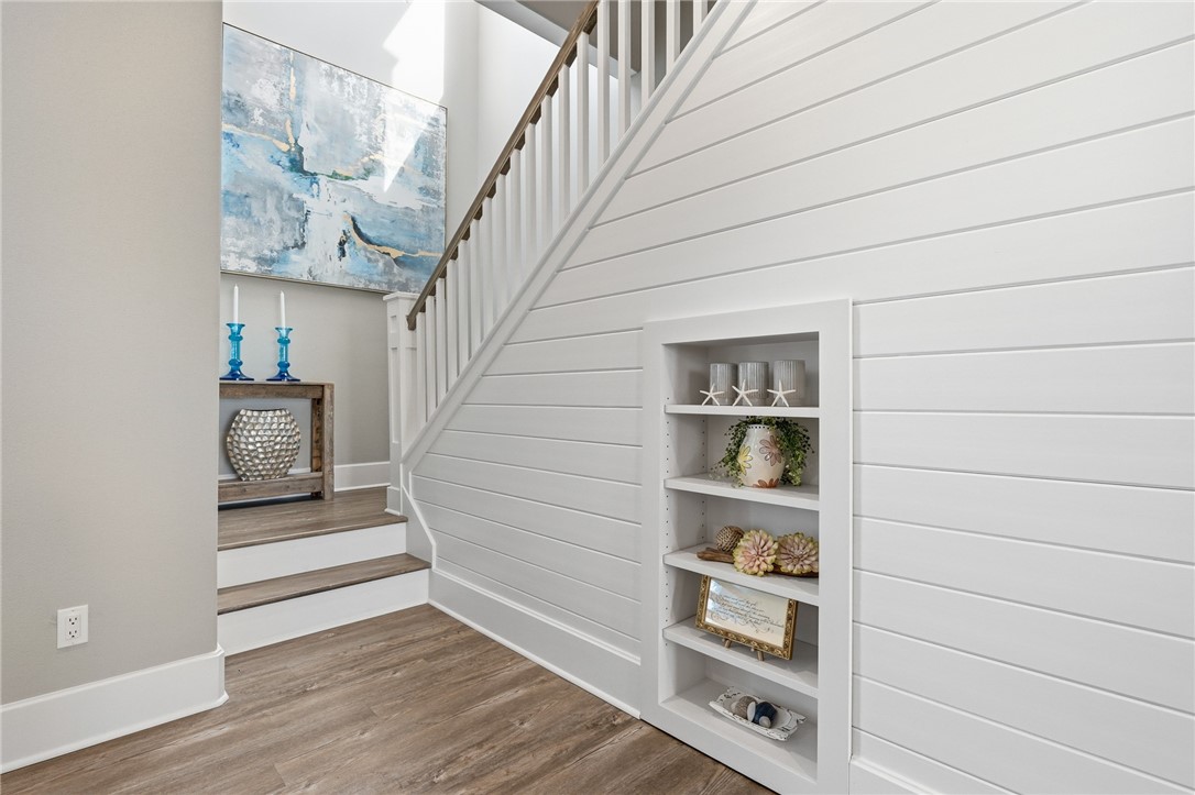 12 Sea Shell Shores Rockport, TX 78382 - Photo 19 of 40 a view of staircase with wooden floor and cabinet