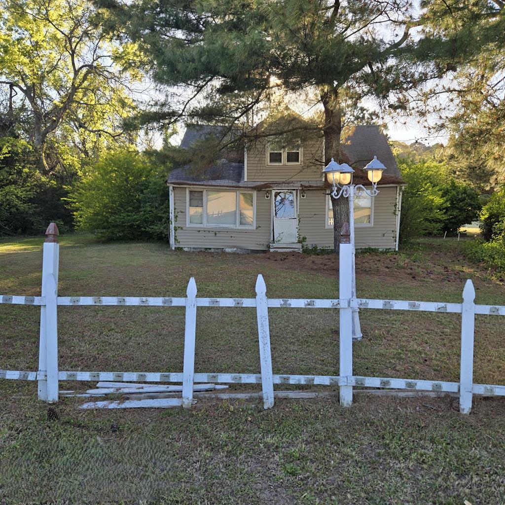 27282 Cheapside Road Cape Charles, VA 23310 - Photo 1 of 16 a front view of a house with a yard