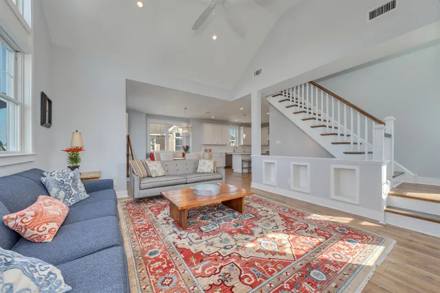 a living room with furniture and a rug