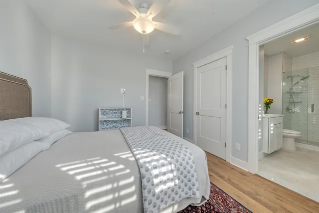 a bedroom with a bed and a view of bathroom