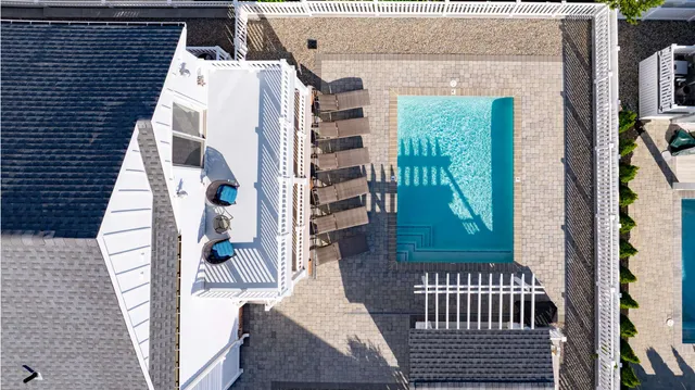 an aerial view of a house with outdoor space and street view