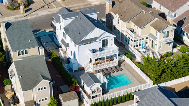 an aerial view of residential houses with street