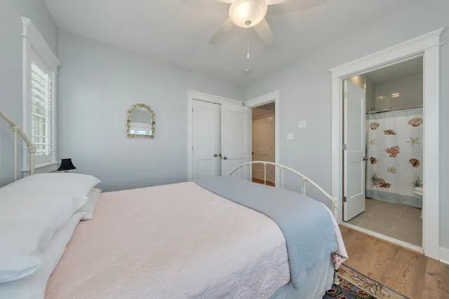 a bedroom with a bed and a view of bathroom