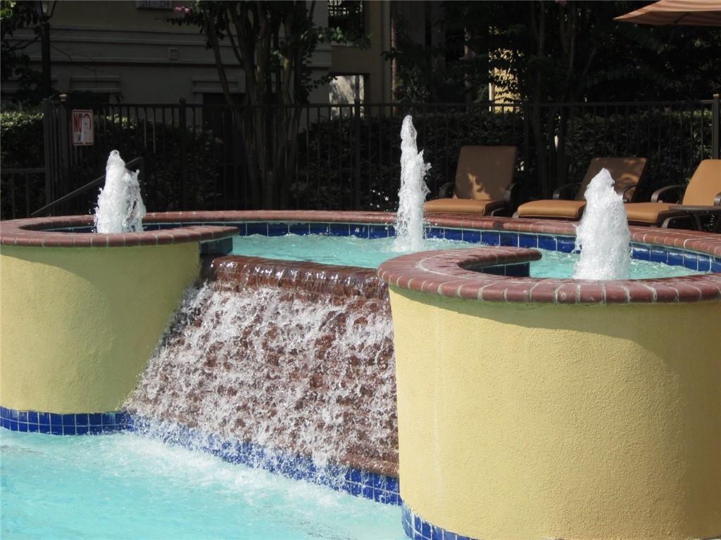 3777 Peachtree Road Northeast, Unit 1324 Brookhaven, GA 30319 - Photo 16 of 48 a view of a swimming pool with a yard
