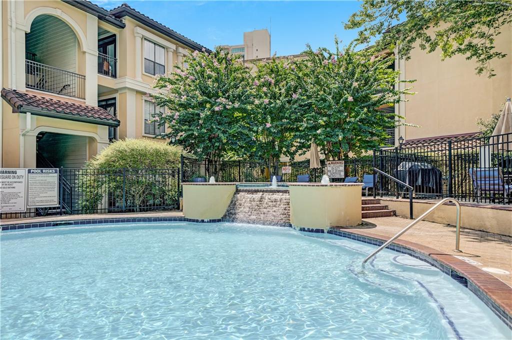 3777 Peachtree Road Northeast, Unit 1324 Brookhaven, GA 30319 - Photo 17 of 48 a view of a building with a tub and a tree