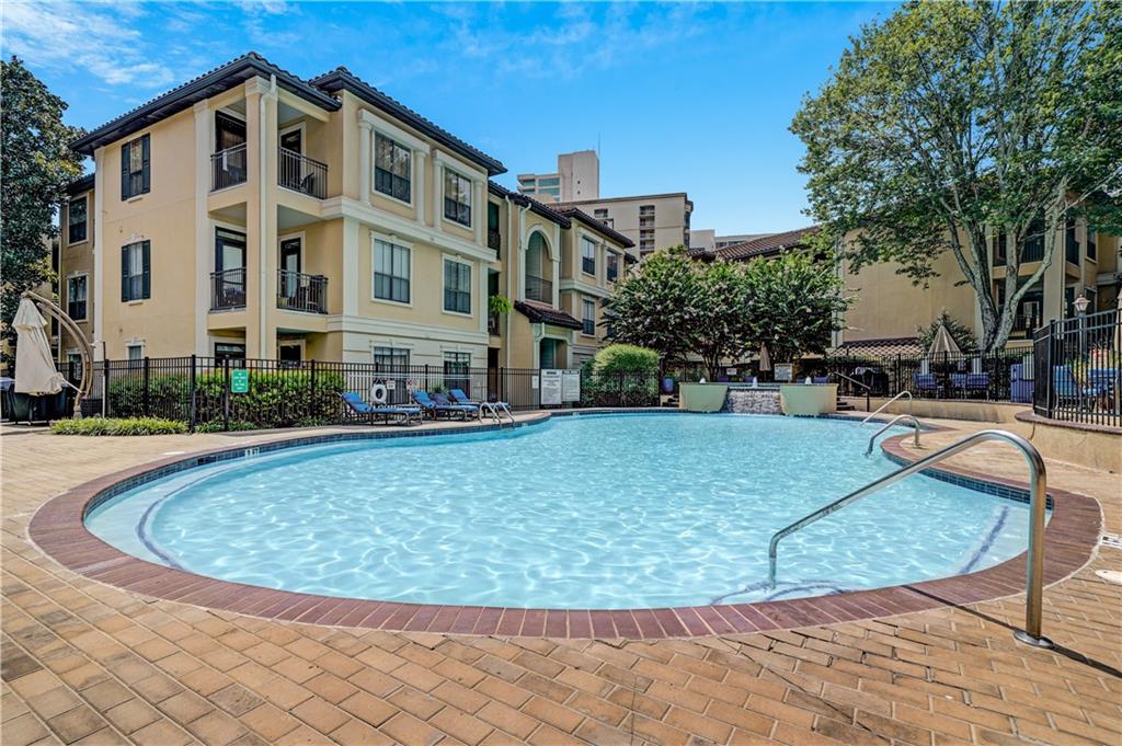 3777 Peachtree Road Northeast, Unit 1324 Brookhaven, GA 30319 - Photo 18 of 48 a view of a swimming pool with a patio