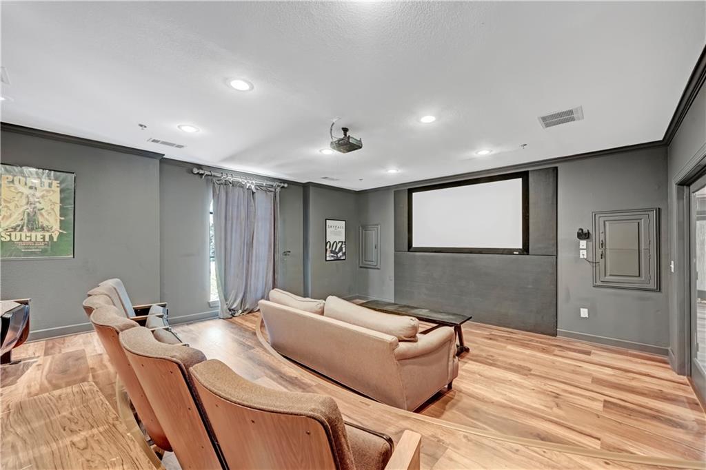 3777 Peachtree Road Northeast, Unit 1324 Brookhaven, GA 30319 - Photo 23 of 48 a room with a bed and a dresser