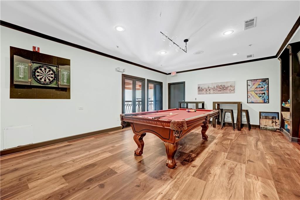 3777 Peachtree Road Northeast, Unit 1324 Brookhaven, GA 30319 - Photo 26 of 48 a living room with a table and a flat screen tv