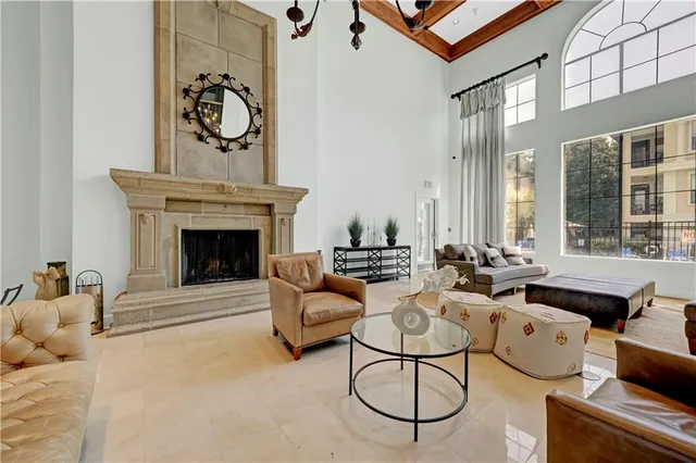 a living room with furniture a rug and a fireplace