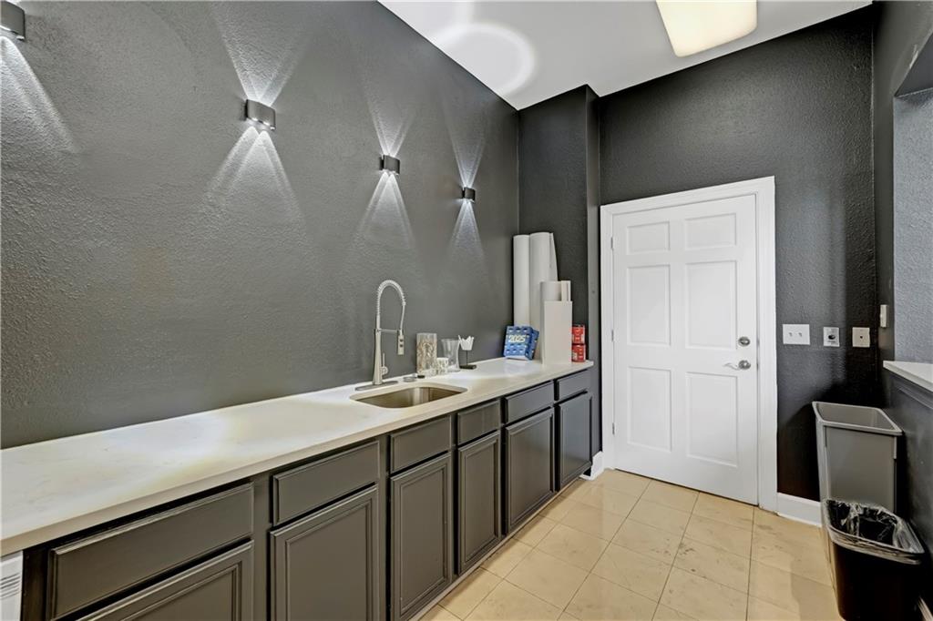 3777 Peachtree Road Northeast, Unit 1324 Brookhaven, GA 30319 - Photo 39 of 48 a en suite bathroom with a sink and mirror