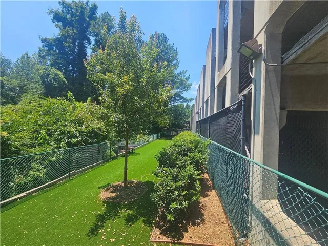 a view of a swimming pool with a patio