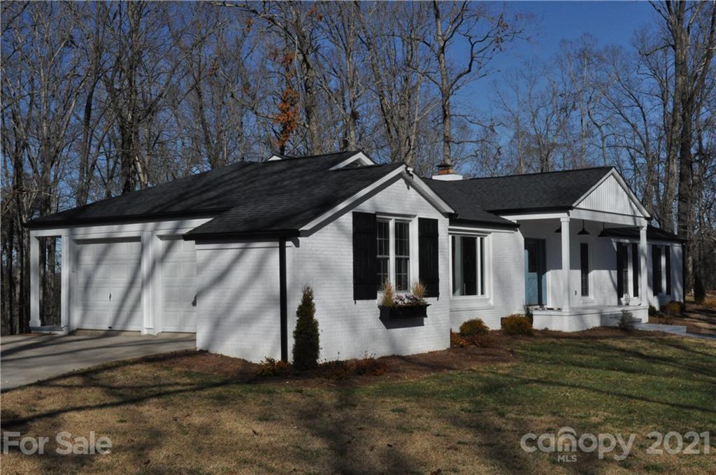 1011 Redland Road Landrum, SC 29356 - Photo 2 of 45 a front view of a house with a yard