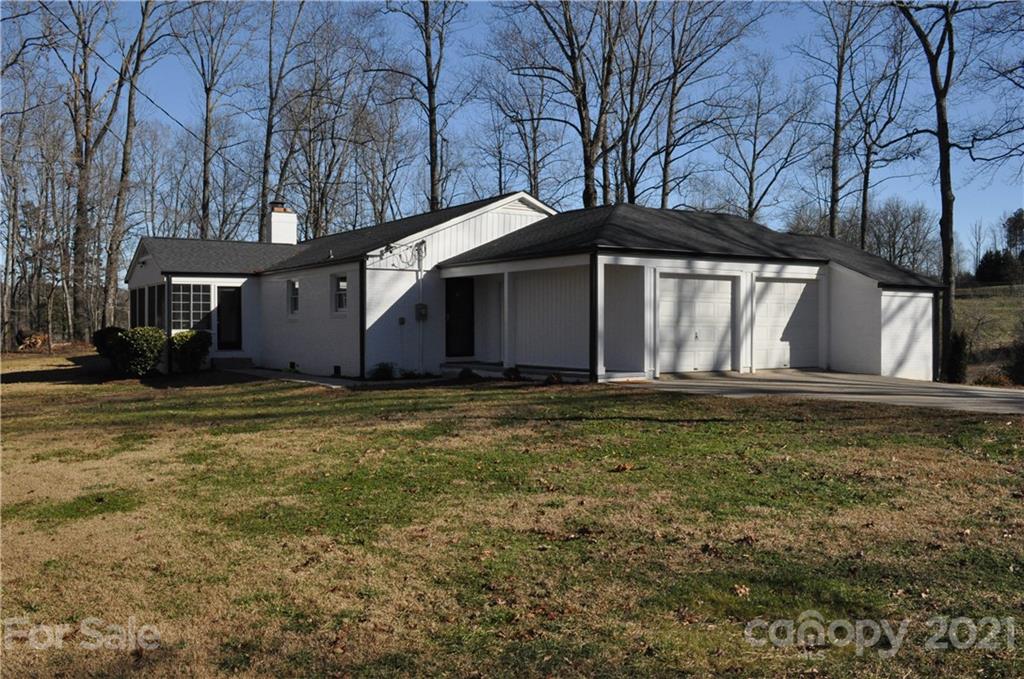 1011 Redland Road Landrum, SC 29356 - Photo 3 of 45 a front view of house with yard and trees around