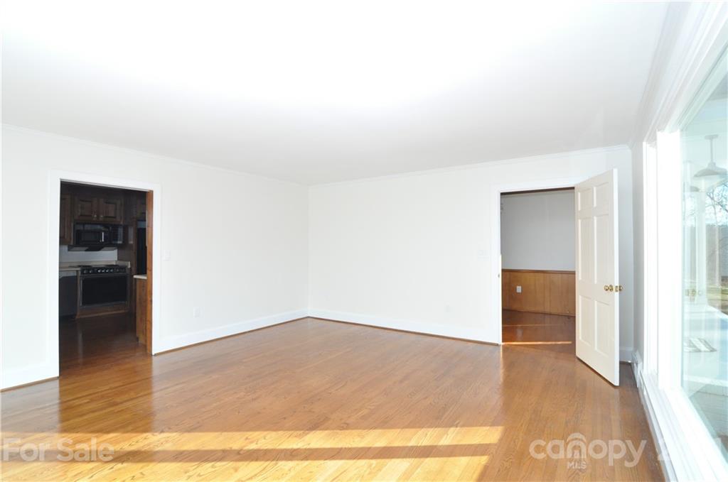1011 Redland Road Landrum, SC 29356 - Photo 21 of 45 an empty room with wooden floor and closet